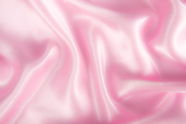 Soyut pembe ipek kumaş dokusu arka planı. Kumaş yumuşak dalga. Saten hazineleri.
