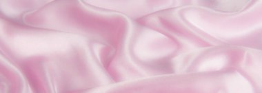 Soyut pembe ipek kumaş dokusu arka planı. Kumaş yumuşak dalga. Saten hazineleri.