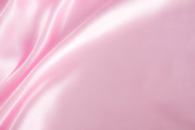 Soyut pembe ipek kumaş dokusu arka planı. Kumaş yumuşak dalga. Saten hazineleri.