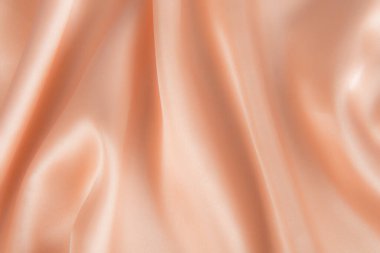 Soyut altın ipek kumaş dokusu arka planı. Kumaş yumuşak dalga. Saten hazineleri.