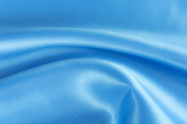 Soyut mavi ipek kumaş dokusu arkaplanı. Kumaş yumuşak dalga. Saten hazineleri.