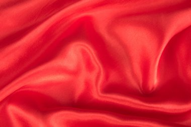 Soyut kırmızı ipek kumaş dokusu arkaplanı. Kumaş yumuşak dalga. Saten hazineleri.