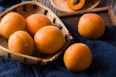  Fresh apricots fruit on wood background