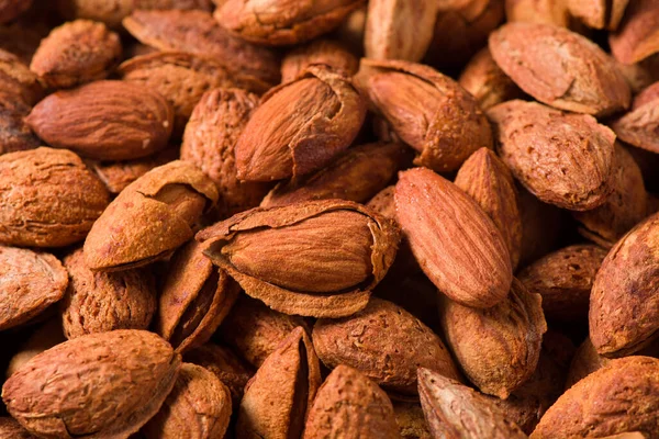 Delicious roasted sweet almonds nuts  background