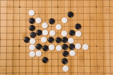 Desk for board game Go or Weiqi  and black and white bones. Traditional asian strategy boardgame