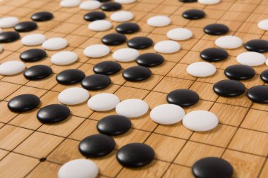 Desk for board game Go or Weiqi  and black and white bones. Traditional asian strategy boardgame