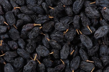 close up of black raisins textured background