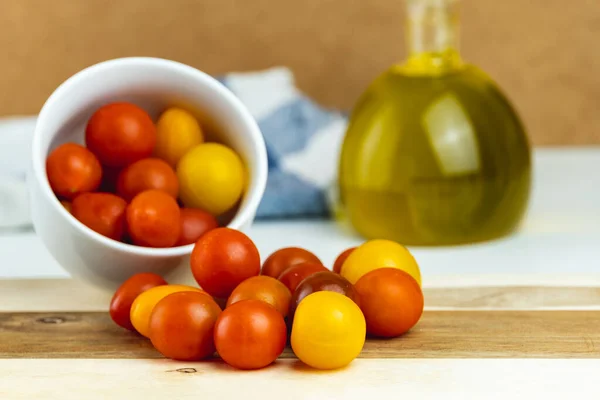 Closeup of various types of cherry tomatoes on a wooden table