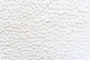 Arkaplan olarak kullanılacak yuvarlak şekilli beyaz taşlı duvar dokusu.