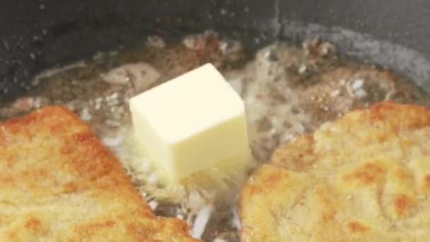 Breaded escalopes being fried in a pan — Stock Video