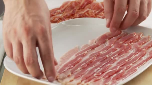 Bacon placed in a pan — Stock Video