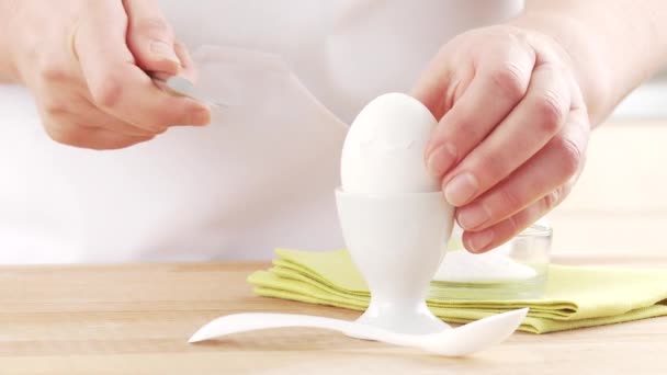 Egg being cut with a knife and salted — Stock Video