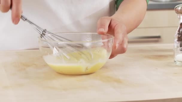 Egg yolk and cream being mixed — Stock Video