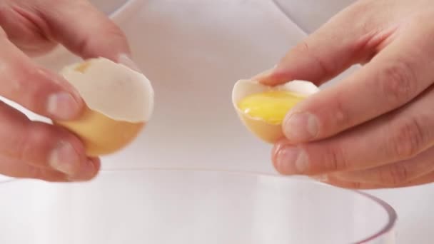 Egg yolk being poured — Stock Video