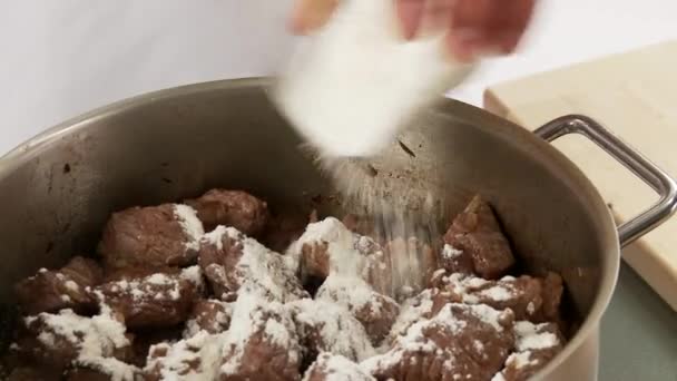 Goulash dusted with flour — Stock Video