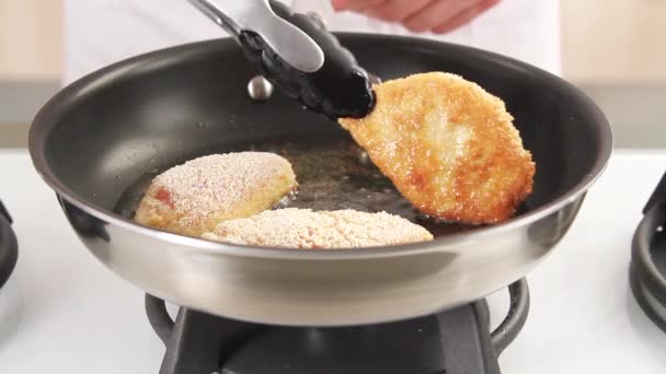 Chicken breasts being fried — Stock Video