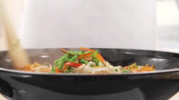 Stir-frying vegetables in a wok — Stock Video