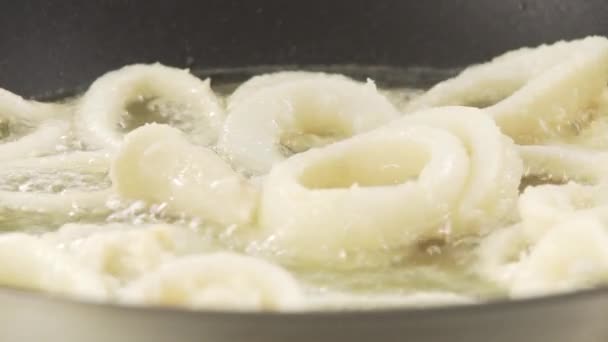 Squid rings being fried — Stock Video
