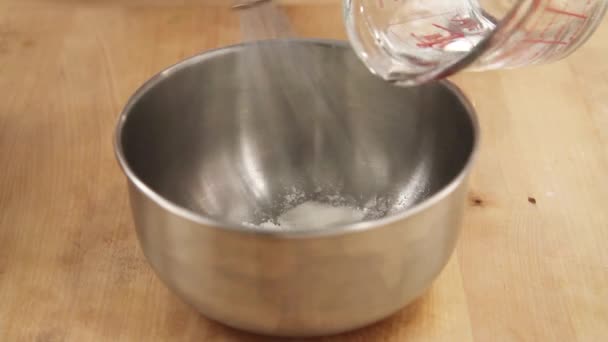 Corn flour being stirred into water — Stock Video