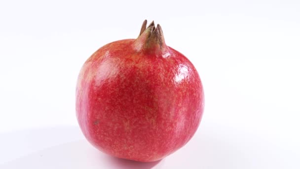 Pomegranate on white background — Stock Video