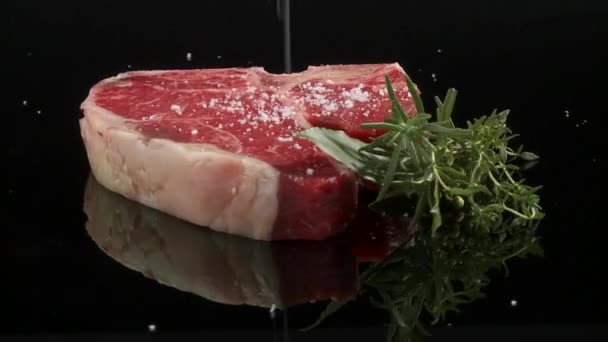 Sprinkling T-bone steak — Stock Video