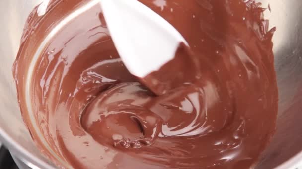 Melted chocolate being mixed in bowl — Stock Video