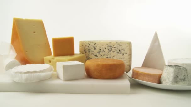 Cheeses on white background — Stock Video