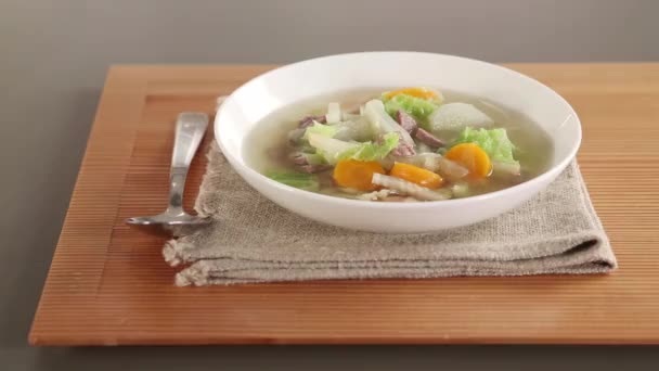 Pot-au-feu with spoon and napkin — Stock Footage Pot-au-feu with spoon and napkin Royalty Free Stock Footage