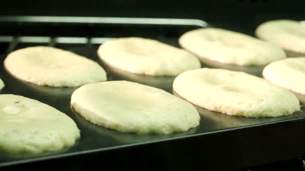 Madeleines baking in the oven — Stock Video