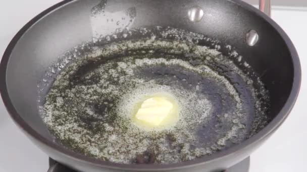 Piece of butter being melted — Stock Video