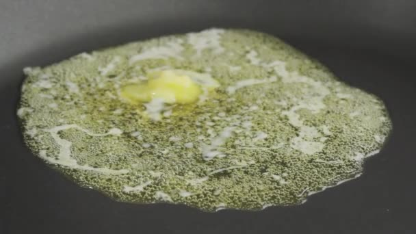 Piece of butter being melted — Stock Video