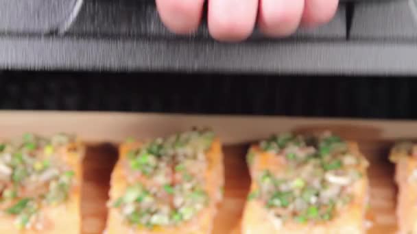 Salmon pieces being grilled — Stock Video