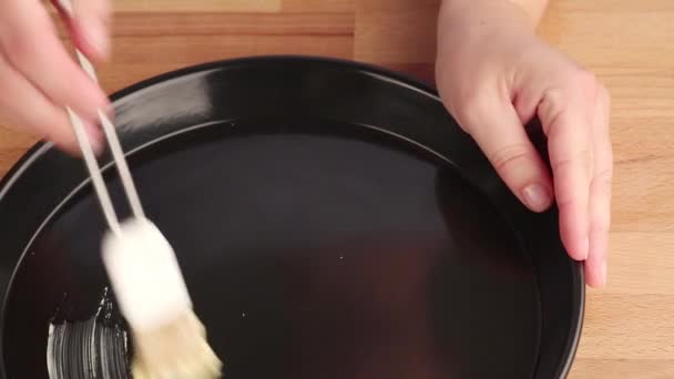 Quiche dish being brushed — Stock Video