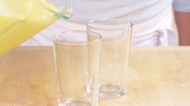 Mang lassi poured into glasses — Stock Video