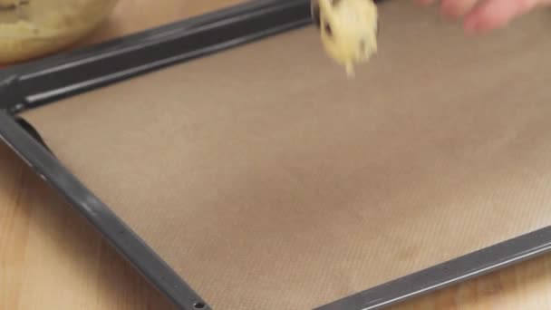 Dough being placed on a baking tray — Stock Video