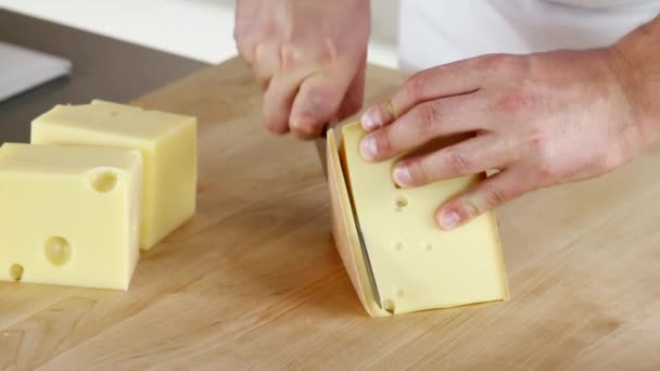 Rind being cut off a piece of cheese being — Stock Video