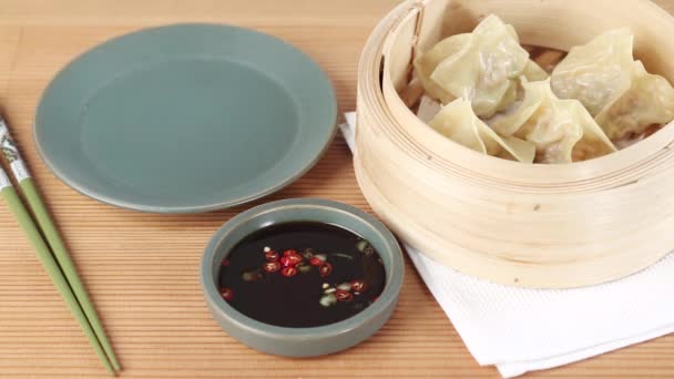 Dim sum in a bamboo basket and soy with — Stock Video