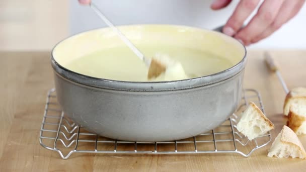 Croutons being dipped into fondue — Stock Video