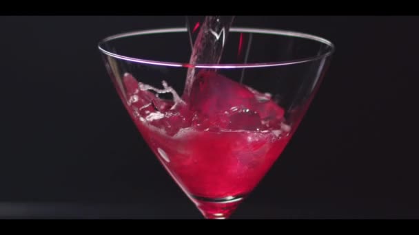 Cosmopolitan being pour into glass — Stock Video