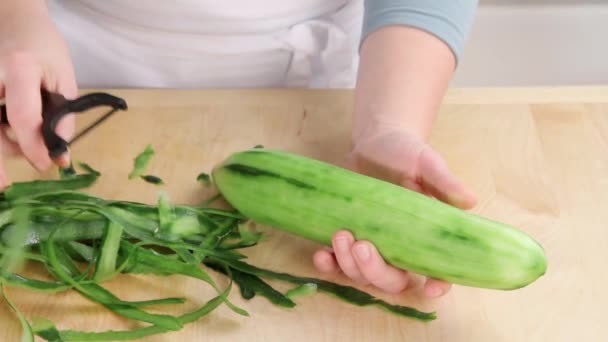 Cucumber being peeled close up — Stock Video