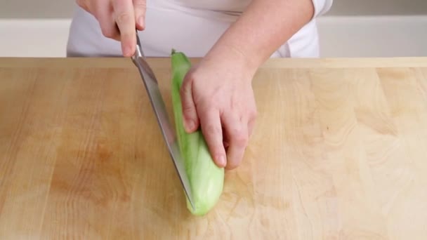 Cucumber being halved — Stock Video