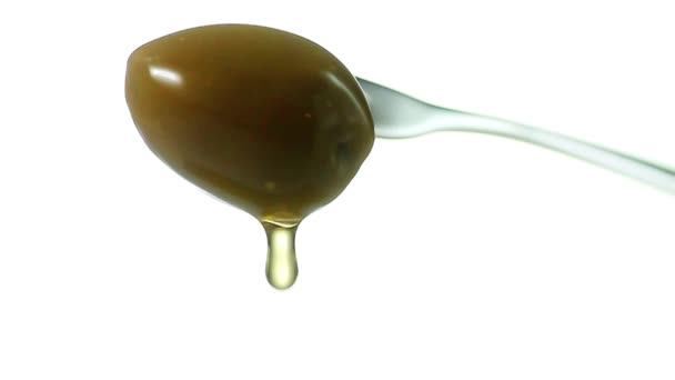 Olive oil dripping from green olive — Stock Video