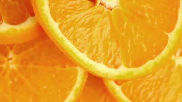 Rodajas de naranja giratorias — Vídeo de stock