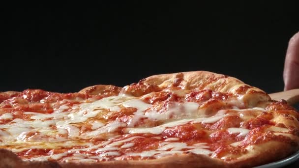 Woman taking a slice of pizza — Stock Video