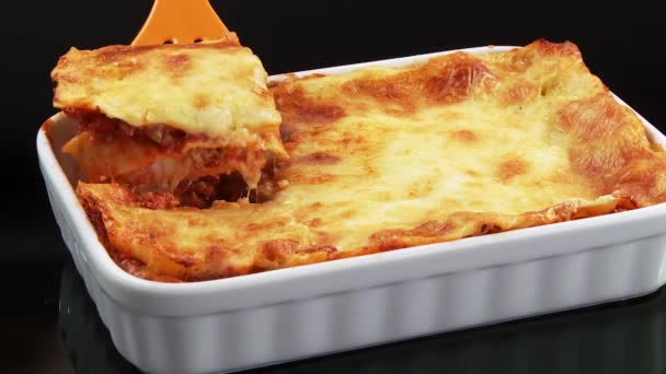 Taking a portion of lasagne — Stock Video