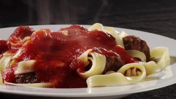 Sprinkling Parmesan over ribbon pasta — Stock Video