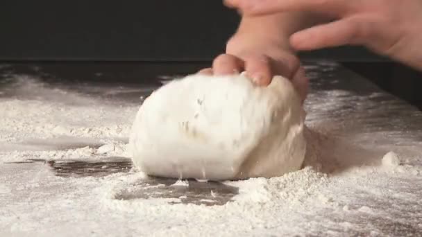 Dough being kneaded on work surface — Stock Video