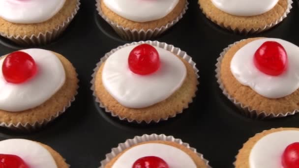 Cupcakes with cocktail cherries — Stock Video