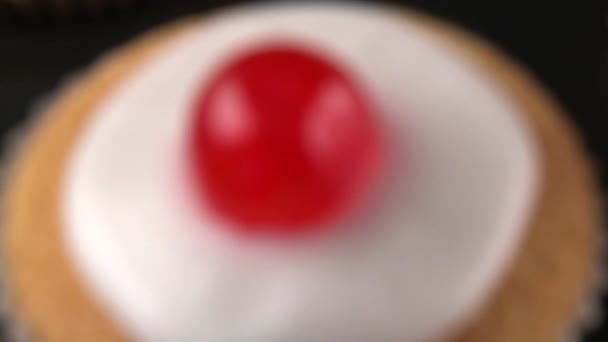 Cupcakes with cocktail cherries — Stock Footage Cupcakes with cocktail cherries Royalty Free Stock Video
