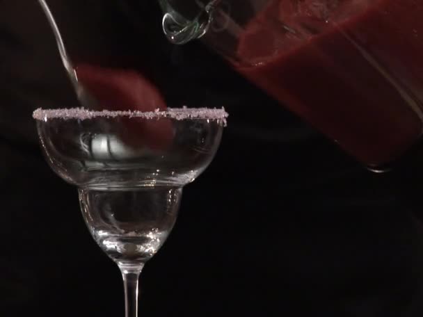 Pouring Daiquiri into a cocktail glass — Stock Video